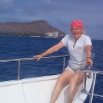 Betty on "Follow Me" boat to meet Jon and Masquerade crew at 2003 Transpac finish off of Diamond Head
